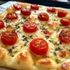 Focaccia with herbs and tomatoes